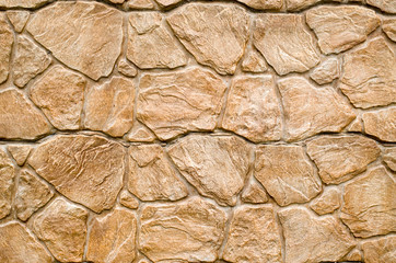 New brown cladding tiles imitating stones on wall