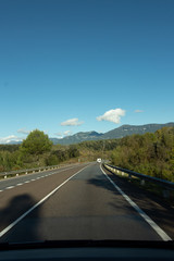 Road to the mountains on a sunny day