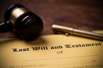 Last will and testament form with gavel. Decision, financial