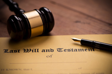 Last will and testament form with gavel. Decision, financial