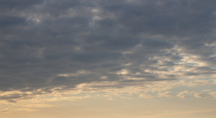 Beautiful sunset in the clouds, bright sun