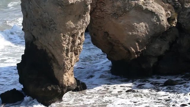 Sea gate. The sea washed the entrance to the cliff