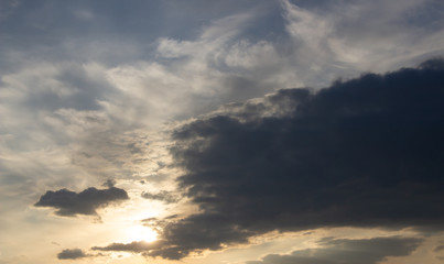 Beautiful sunset in the clouds, bright sun