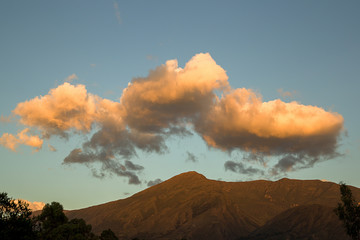 Multiple exposure of fluffy yellow clouds over Iguaque mountain, near the colonial town of Villa de Leyva, in the central Andes of Colombia.