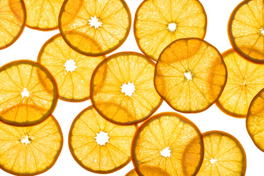 Slices of orange on white background. Close up. Top view. High resolution product