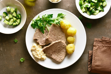 Boiled beef with potatoes and horseradish
