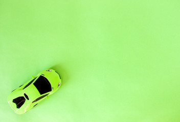 green toy sports car - obrazy, fototapety, plakaty