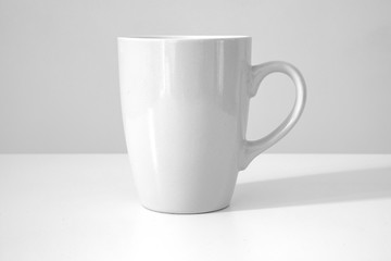 Fototapeta premium White mug on a white background.