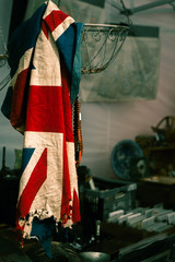 Tattered British Flag Hanging in an Antique Shop