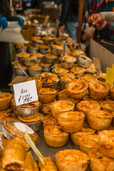 Savoury Pies for Sale at a Market Stall in England © ystewarthenderson