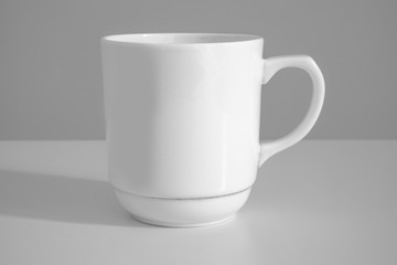 White mug on a white background.