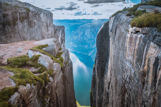 Aerial view of Lysefjorden from Kjeragbolten, with waterfall on the cliff and mountains in background, on the mountain Kjerag in Forsand municipality in Rogaland county, Norway.