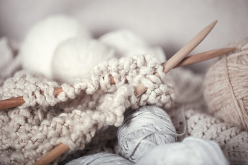 The macro concept of knitting wool and needles - obrazy, fototapety, plakaty