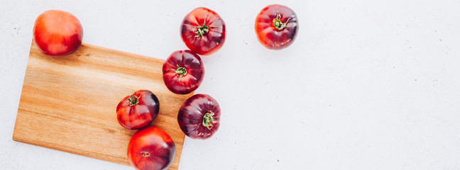 Tomatoes Mar Azul on white wooden table background