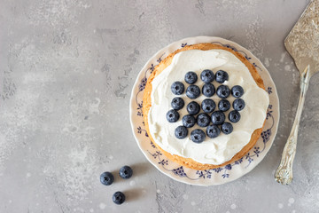 Angel food cake with whipped cream and fresh blueberries. 