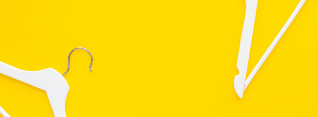 White hangers background for sale shopping concept