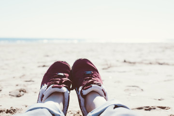 Naklejka premium Girl relaxing on sand beach
