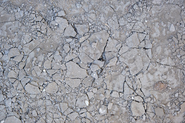 fragment of gray cracked cement floor