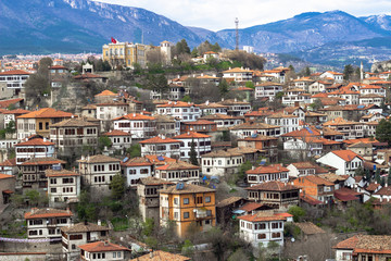 Fototapeta na wymiar Town perspective wide photo of old houses situated on the hill in Safranbolu, Turkey