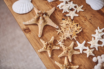 Starfish and shells on the table. Summer background from seashell