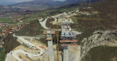 Aerial view of construction site of new bridge and highway in Bosnia and Herzegovina - Powered by Adobe