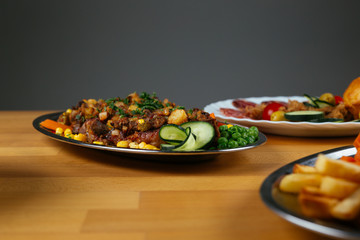 Close up of delicious food on wooden table.