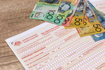 Naklejka premium Australian taxation company, individual form with aud banknotes