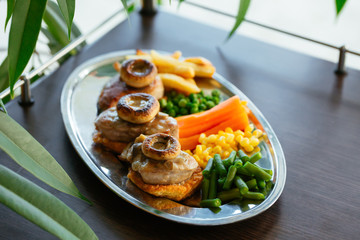 Close up of delicious food on brown table.