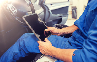 car service, repair, technology, maintenance and people concept - mechanic man with tablet pc computer making system diagnostic at workshop