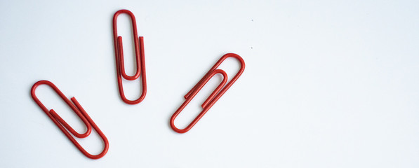 colored clips scattered on white background, form some pattern