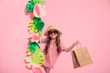 Portrait of cute little girl with shopping bag