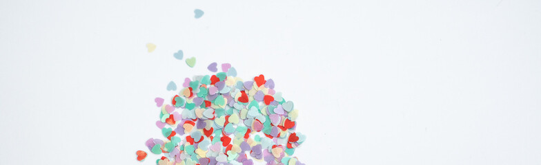 colored Sequin scattered on white background