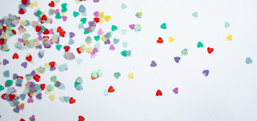 colored Sequin scattered on white background