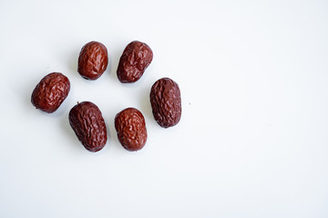 Red dried Jujubes isolated in white background, health food