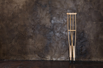 wooden crutches on the  grungy wall.