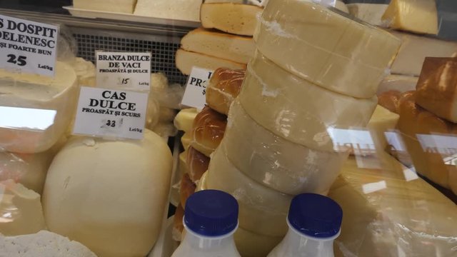 Selling a variety of cheese at the stall footage - stock cheese video