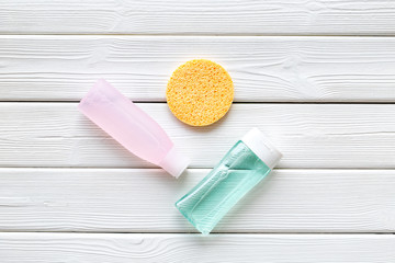 Organic cosmetics for face clearing with sponge, facial tonic and mycelial water on white background top view copy space