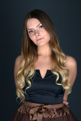 Fototapeta premium Beautiful smiling woman with clean skin, natural make-up, and white teeth on grey background 