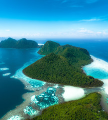 Amazing tropical paradise islands from the air with blue turquoise blue lagoon water and coral...