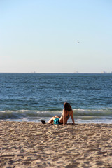 Woman at the beach relaxing 