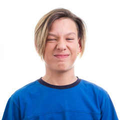 teenager making faces on white background close-up