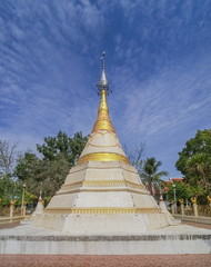 Fototapeta premium White Chedi or Pagoda Mon style art with blue sky background, Wat Muang, Banpong District, Ratchaburi, Thailand.