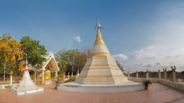 White Chedi or Pagoda Mon style art with blue sky background, Wat Muang, Banpong District, Ratchaburi, Thailand.