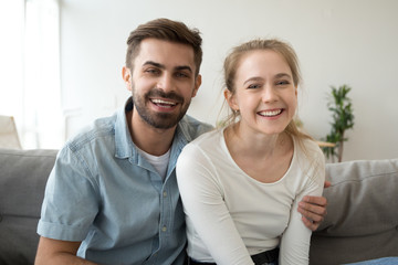 Head shot portrait of smiling couple, look at camera, making video call