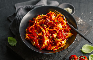 Italian spaghetti with tomato sauce served on plate