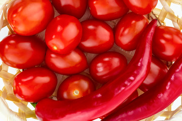 tomatoes many red vegetables mini bright juicy fresh with hot chili close-up background design