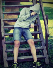 boy with grey hoddie in the playground