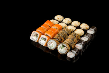 large set of rolls of fish and vegetables. Japanese food