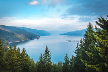 Fototapeta na wymiar Beautiful scenery with big blue lake, forest , mountans and blue sky