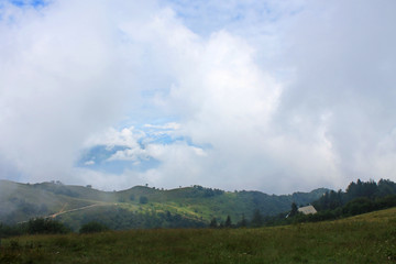 Low clouds on the mountain Mottarone, Italy